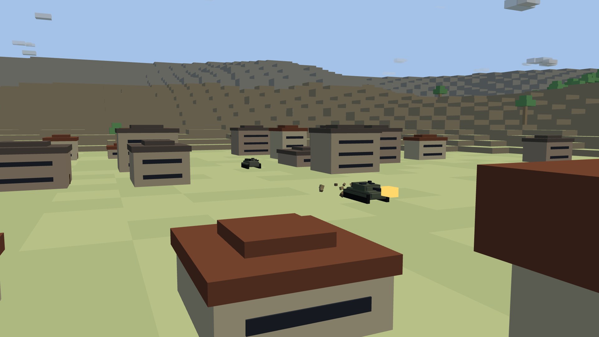 A tank and an infantry fighting vehicle pushing down a town's main street between blocky houses, dust rising off the lead tank's treads